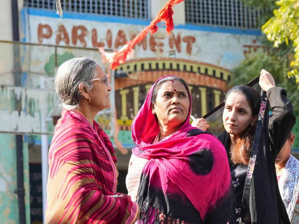 Voters wait to cast votes at a polling booth during the Delhi Assembly elections, in New Delhi, Wednesday, Feb. 5, 2025. (PTI Photo/Kamal Kishore)