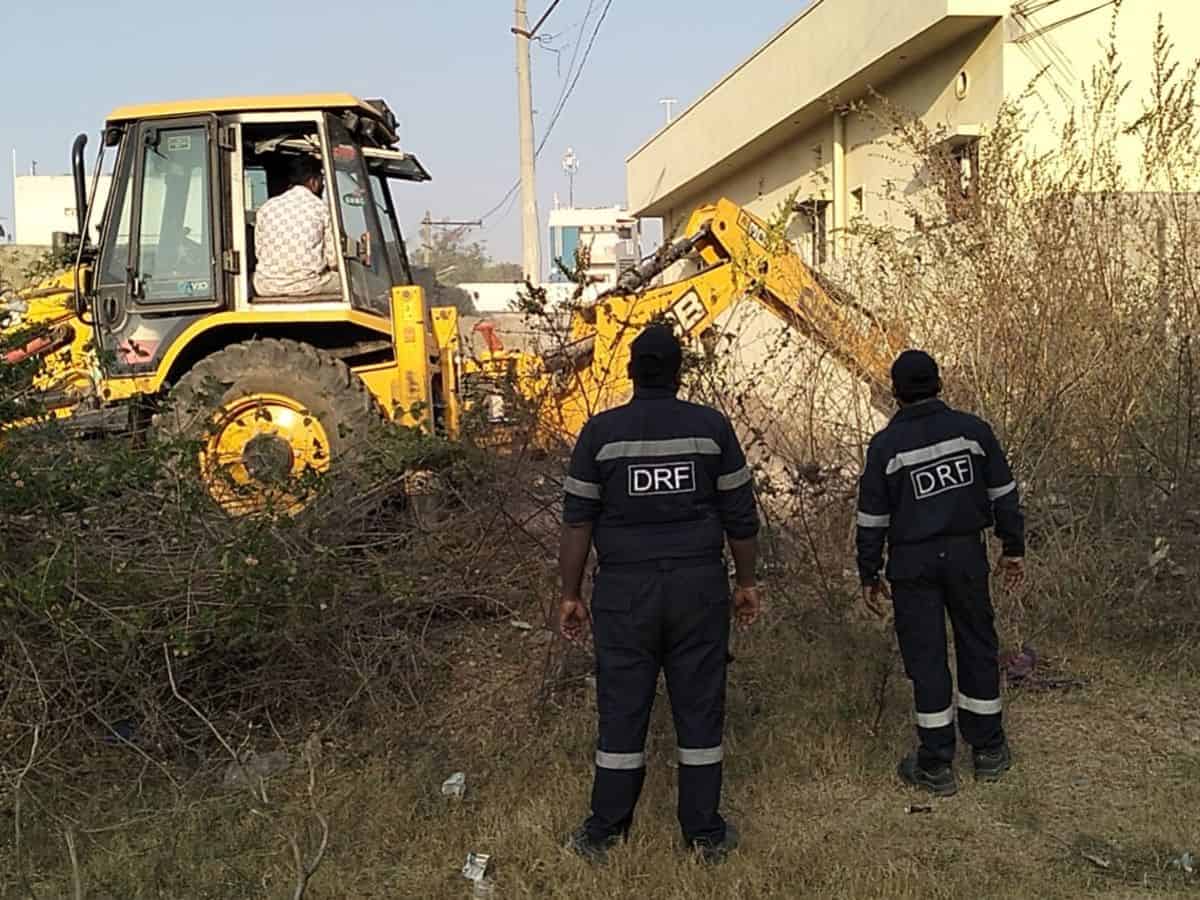 HYDRAA demolishes boundary wall preventing Dalits from entering their street in Devarayamjal.