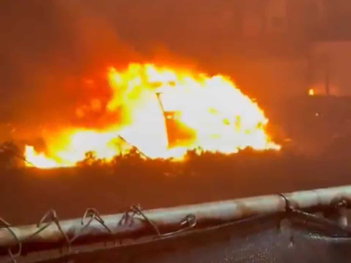 Car on fire after plane crash in Philadelphia us
