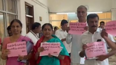 BRS MLAs protest entering the assembly wearing black badges demanding full implementation of farm loan waiver up to Rs 2 lakh.