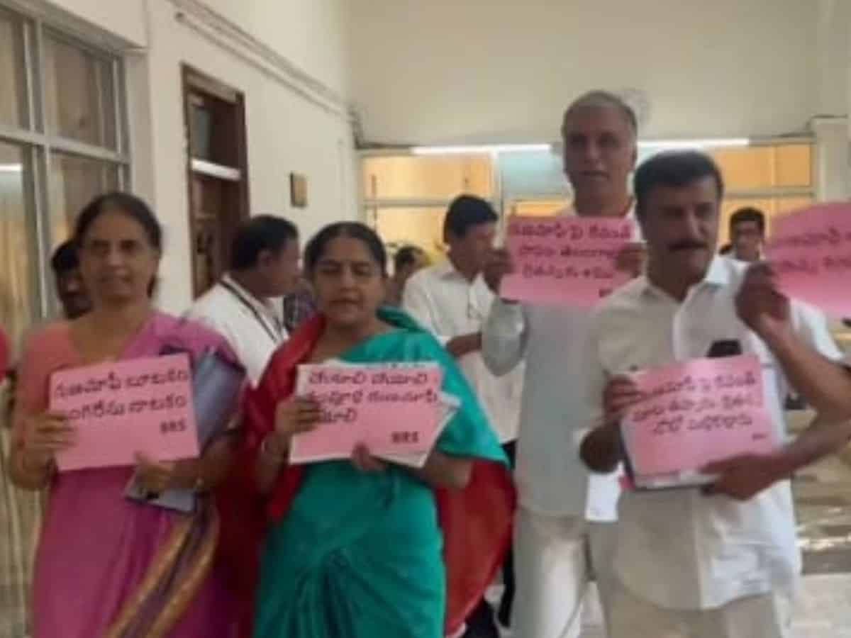 BRS MLAs protest entering the assembly wearing black badges demanding full implementation of farm loan waiver up to Rs 2 lakh.