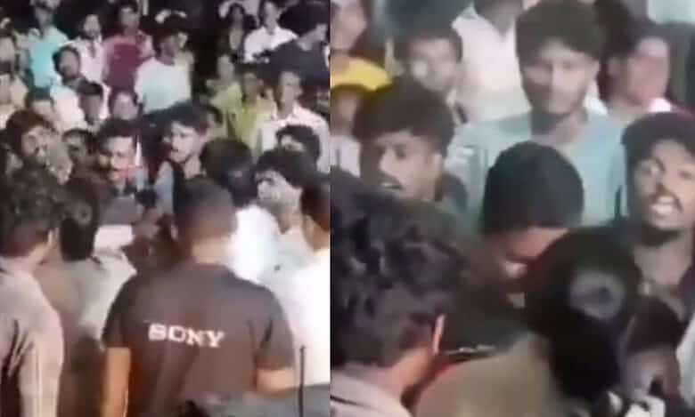 Female SI attacked during a jathara at Gudivada in AP on Tuesday night, March 11.