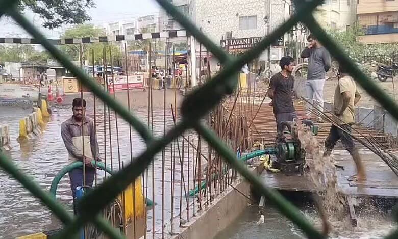 road under bridge kondapur water logging