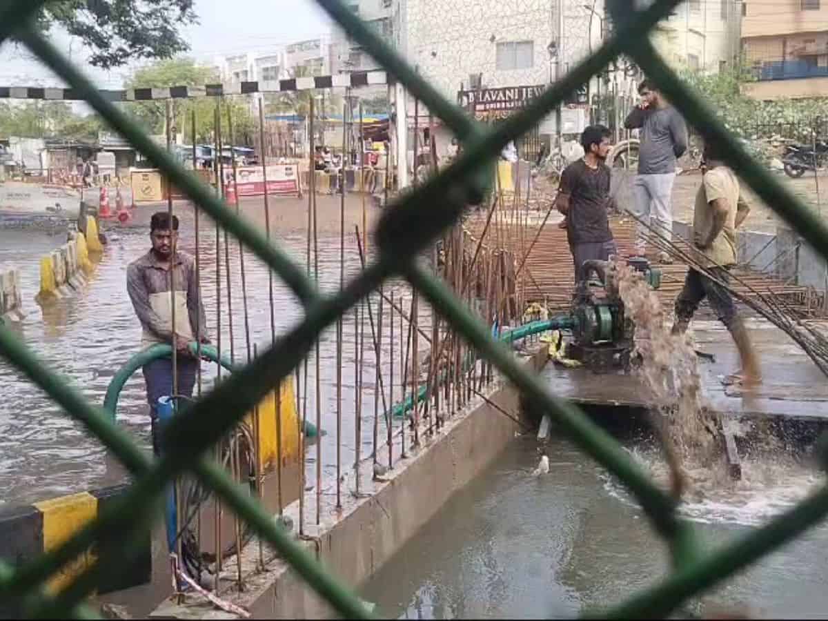 road under bridge kondapur water logging