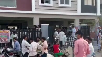 People gather at the scene where a Hyderabad doctor was tragically crushed by an elevator in Qutbullapur.