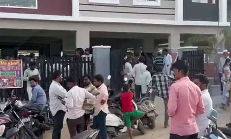 People gather at the scene where a Hyderabad doctor was tragically crushed by an elevator in Qutbullapur.