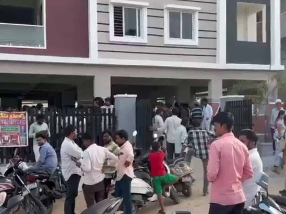 People gather at the scene where a Hyderabad doctor was tragically crushed by an elevator in Qutbullapur.