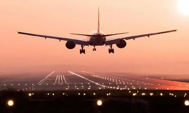 A flight landing on runway of airport.