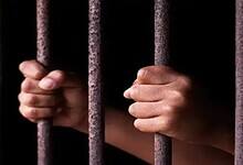 A Representational image of a person in jail
