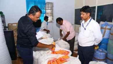 Four officials from BIS Hyderabad engaged in sorting unlabeled items.