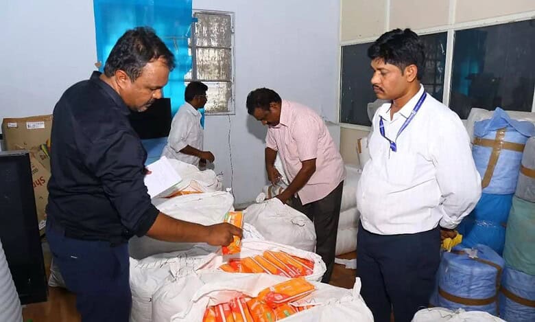 Four officials from BIS Hyderabad engaged in sorting unlabeled items.