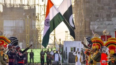 India's national flag and Pakistan's national flag being lowered during the Beating Retreat ceremony.