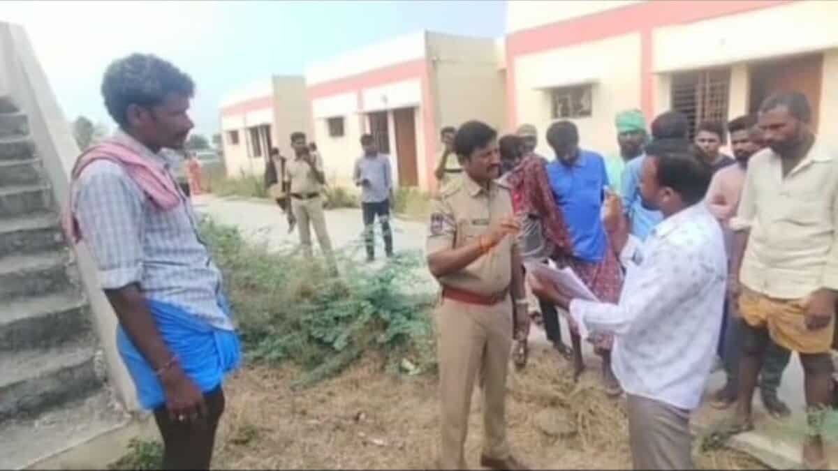 The image shows residents of Chinnagudur mandal in Mahabubabad district arguing with the police, demanding allotment of 2bhk houses on Thursday, April 24.