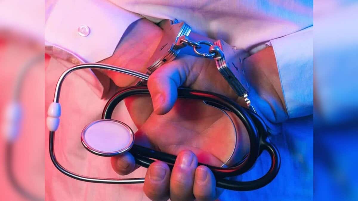Handcuffed person holding a stethoscope, symbolising arrest of a fake doctor or medical fraud at Hyderabad hospital