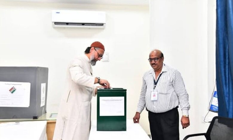 The image shows AIMIM chief Asaduddin Owaisi casting his vote for the Hyderabad local authorities MLC election held on Wednesday, April 23, 2025.