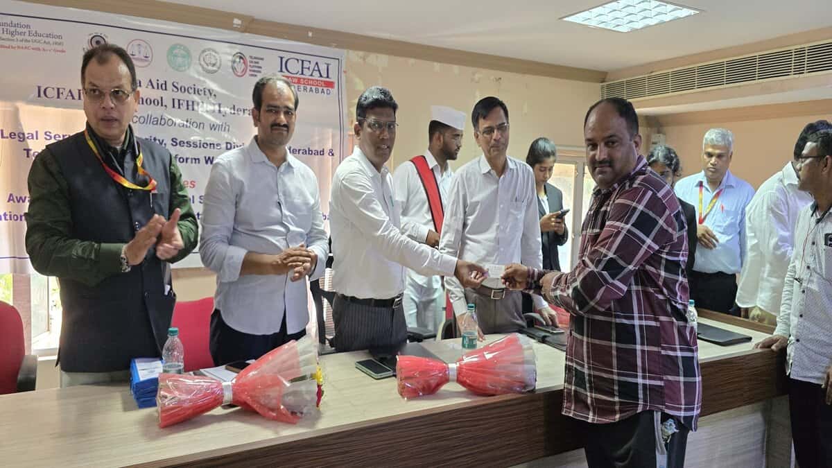 A Telangana Gig and Platform Workers Union member receives e-Shram card at a programme organised at ICFAI law school in Hyderabad