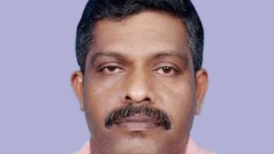 An Indian technician, who won the Big Ticket jackpot, wearing a pink shirt against a plain background.