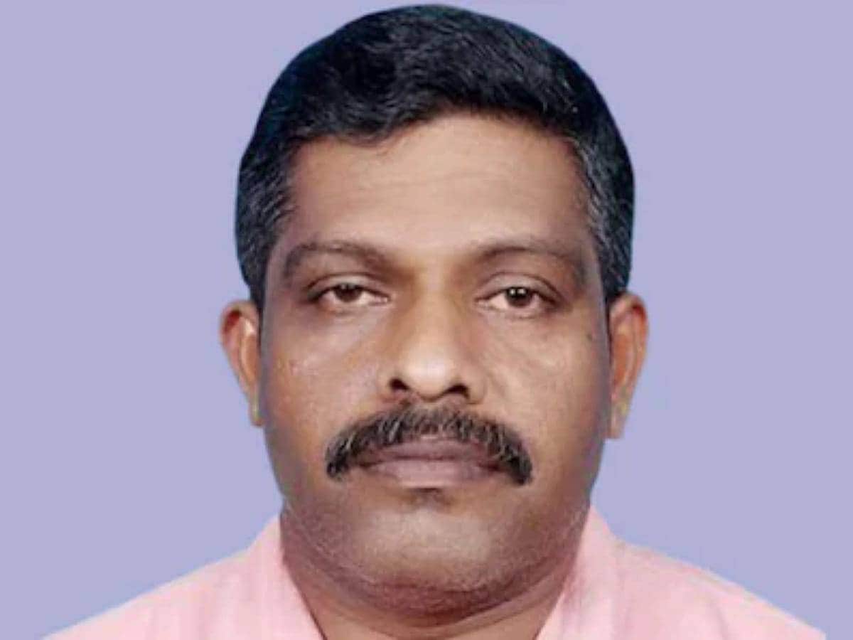 An Indian technician, who won the Big Ticket jackpot, wearing a pink shirt against a plain background.