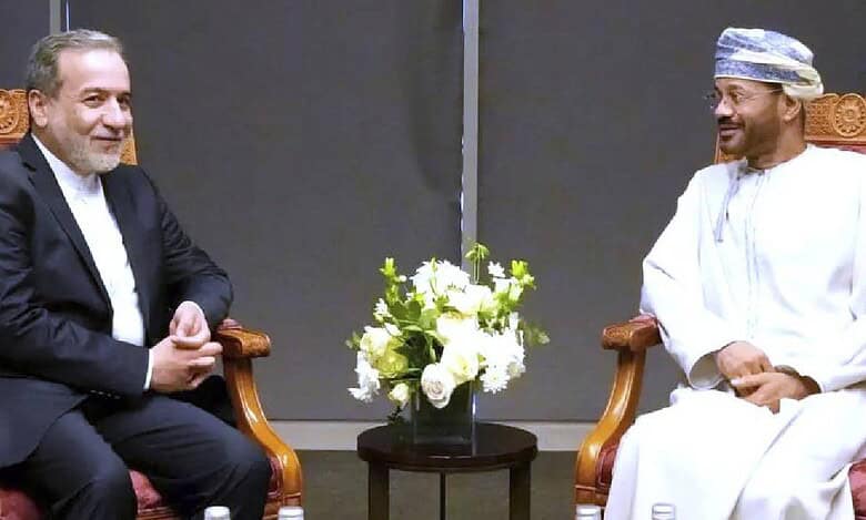In this photo released by Iranian Foreign Ministry, Iranian Foreign Minister Abbas Araghchi, left, meets his Omani counterpart Sayyid Badr Albusaidi prior to negotiations with US Mideast envoy Steve Witkoff in Muscat, Oman, Saturday, April 12.
