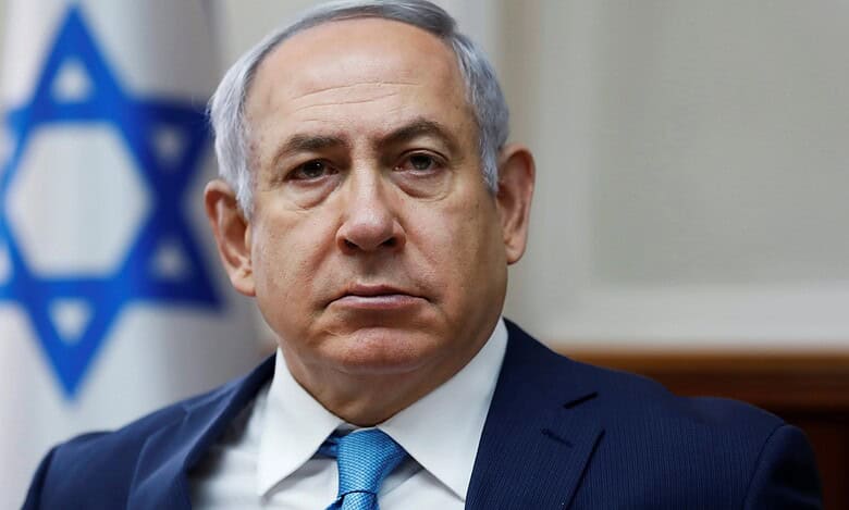 Photo of Israeli Prime Minister Benjamin Netanyahu in front of national flag
