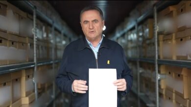 Israeli Defence Minister Israel Katz displays a document in a storage facility, claiming evidence of financial links between Hamas and Iran