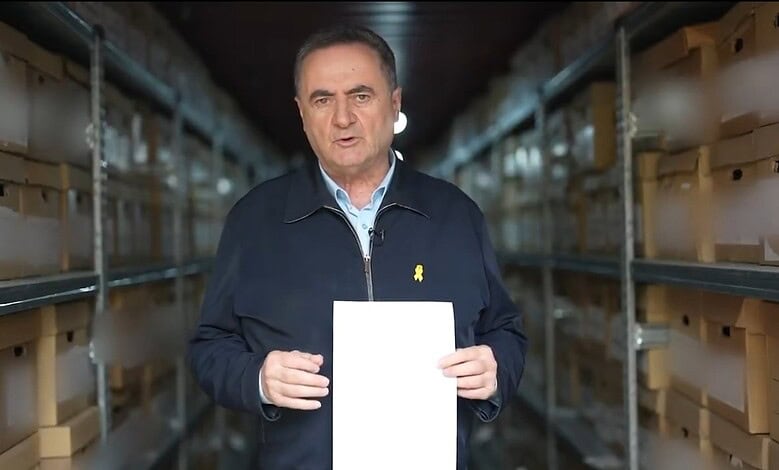 Israeli Defence Minister Israel Katz displays a document in a storage facility, claiming evidence of financial links between Hamas and Iran