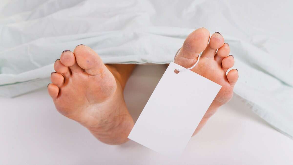 Representational Image of man laying in morgue
