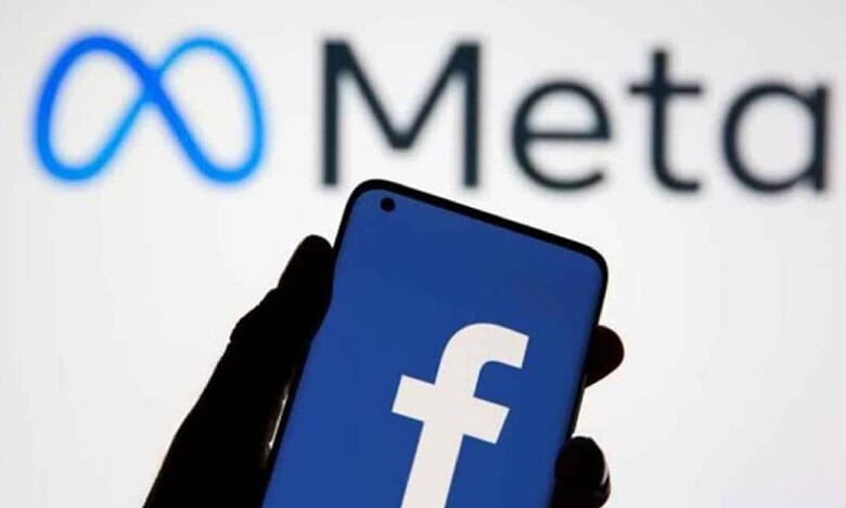 A smartphone displaying the Facebook logo in front of the Meta company logo, representing Meta Platforms, the parent company of Facebook.