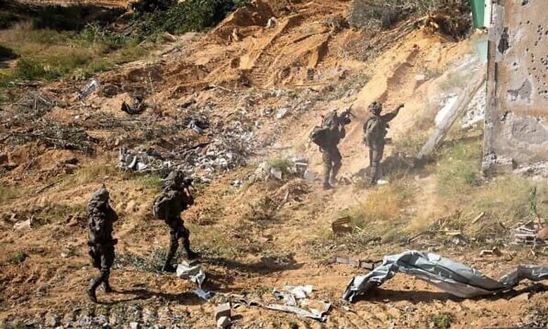 Israeli 36th Division soldiers patrol the Morag Corridor in southern Gaza Strip, amid rubble and damaged buildings.