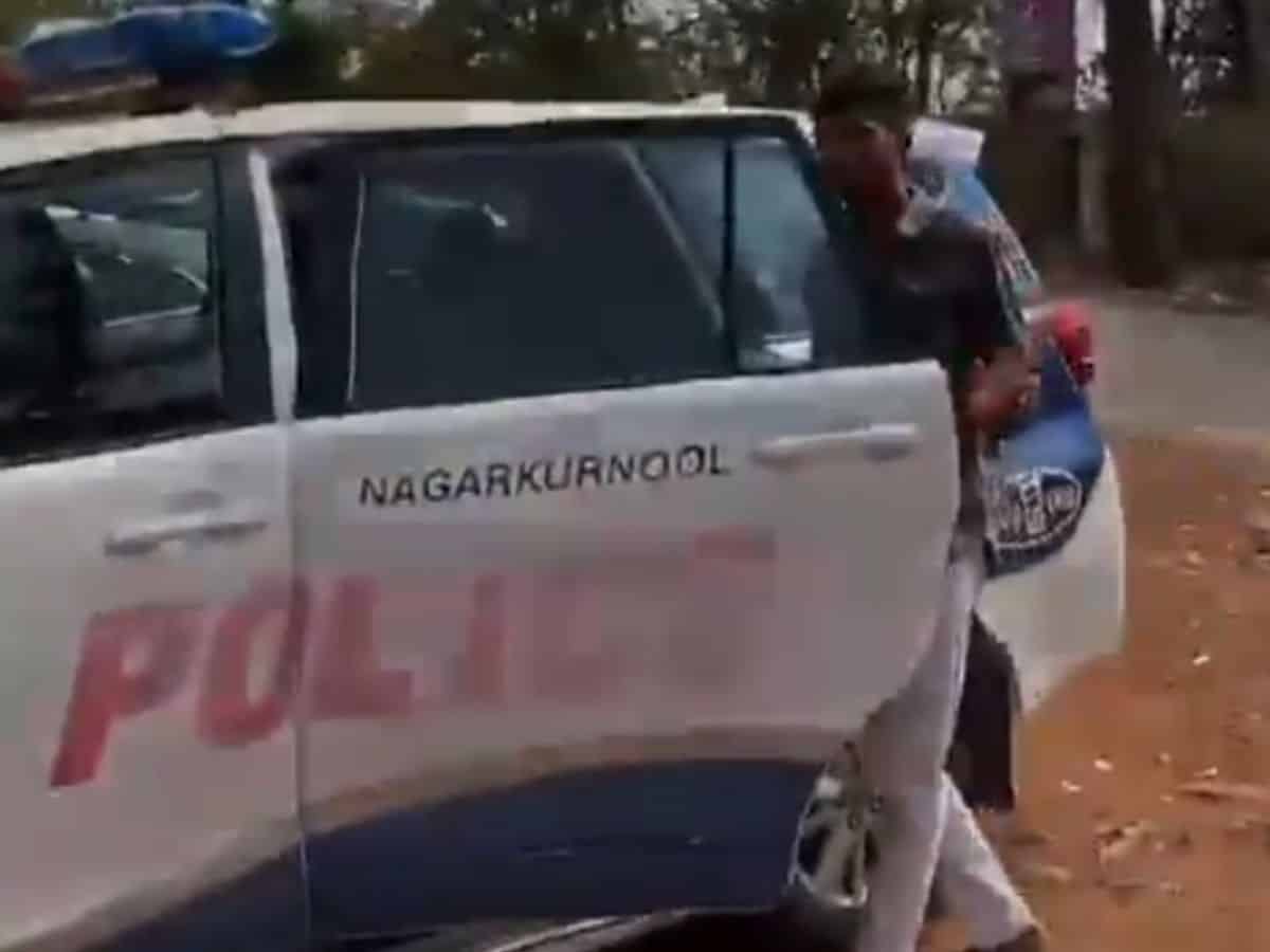 Nagarkurnool police car being used to create a reel.