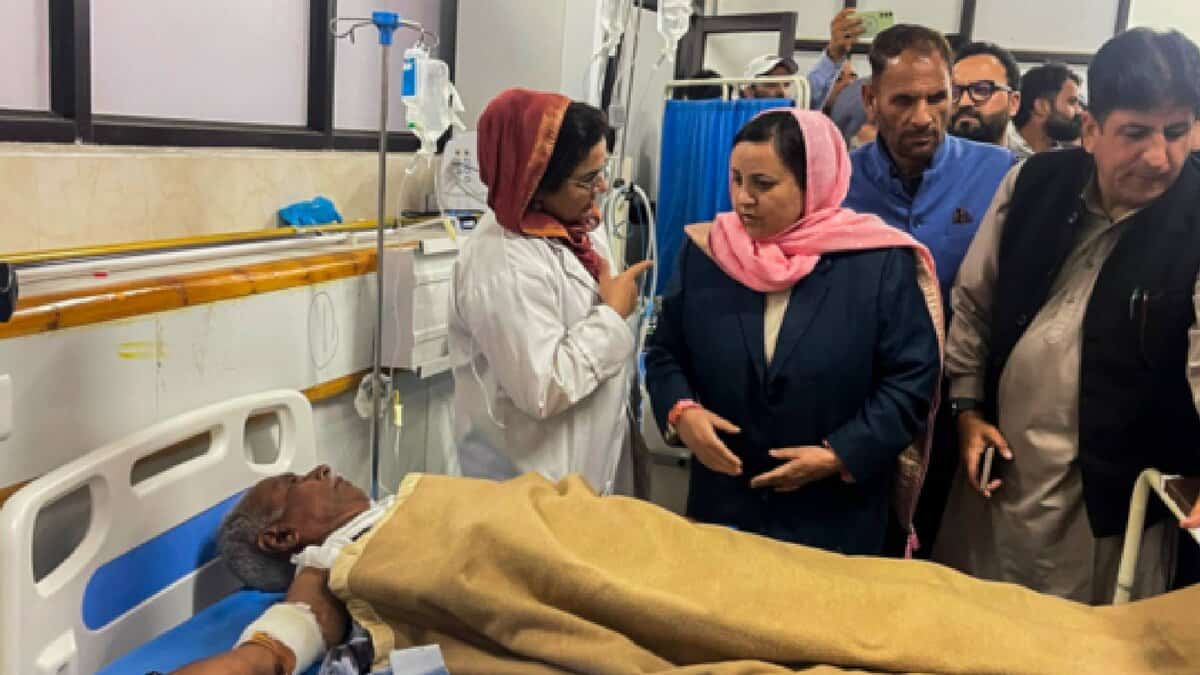 Jammu and Kashmir Minister Sakina Itoo speaks with medical staff while visiting an injured victim of the Pahalgam terror attack receiving treatment at a hospital in Anantnag district.