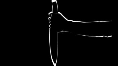 Individual holding a knife