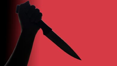 Representational Image of man holding a knife
