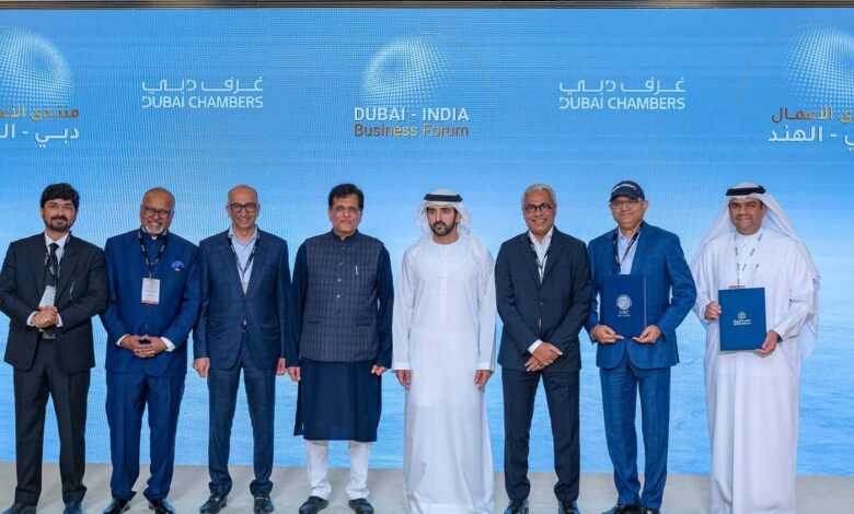 Sheikh Hamdan stands with Indian and Emirati business leaders at the Dubai-India Business Forum in Mumbai.
