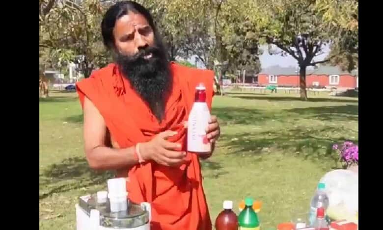 Ramdev Baba with Patanjali sharbat bottle