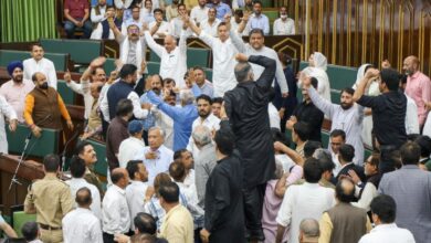 MLAs raise slogans during the Budget session of the J&K Assembly in Jammu on Monday.