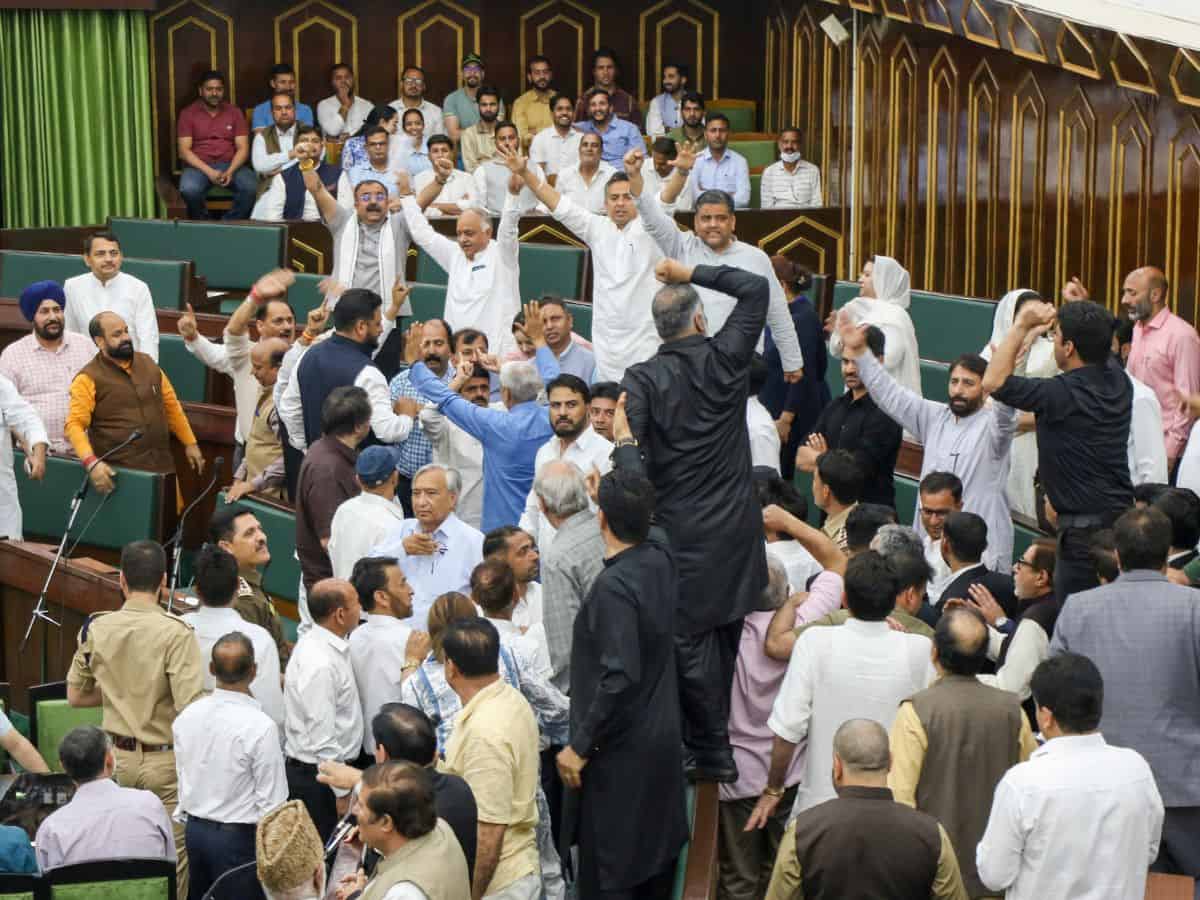 MLAs raise slogans during the Budget session of the J&K Assembly in Jammu on Monday.