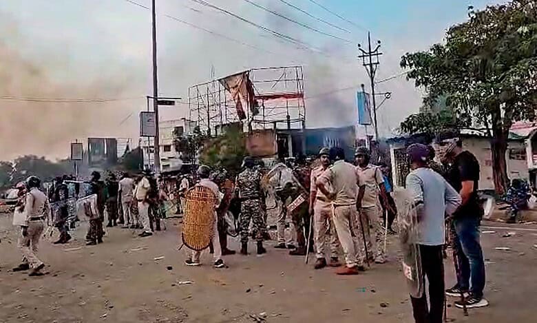 The image displays police officials with some locals in West Bengal's Murshidabad. April 13, 2025