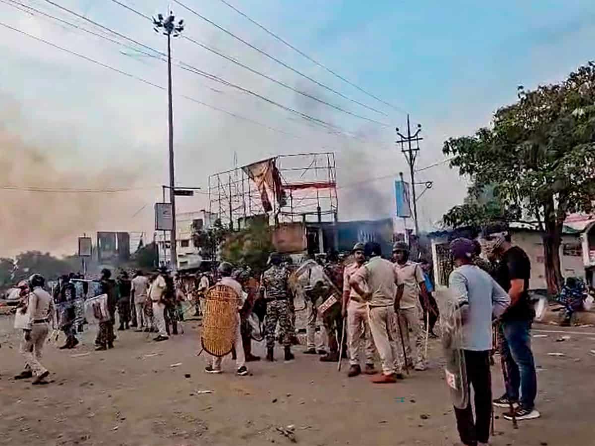 The image displays police officials with some locals in West Bengal's Murshidabad. April 13, 2025