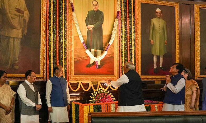 The image displays Congress president Mallikarjun Kharge paying his tributes on the occasion of Dr BR Ambedkar birth anniversary in New Delhi on Monday. April 14, 2025
