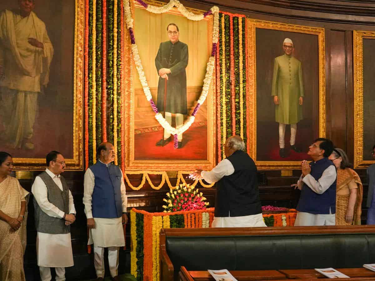 The image displays Congress president Mallikarjun Kharge paying his tributes on the occasion of Dr BR Ambedkar birth anniversary in New Delhi on Monday. April 14, 2025
