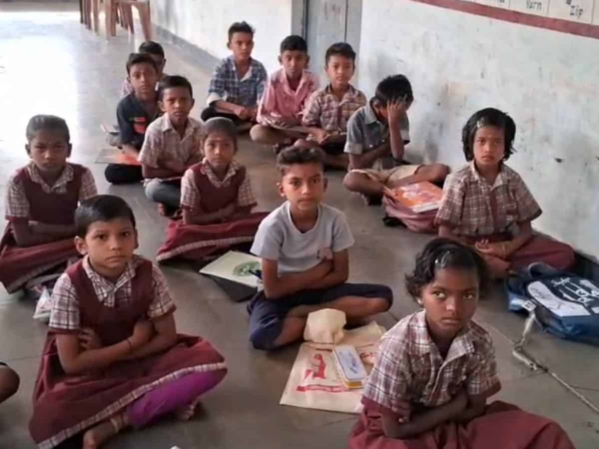 The image displays students of a government primary school in Adilabad, Telangana. April 16, 2025