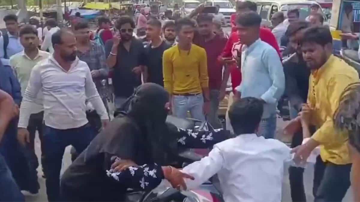 The image displays an inter faith couple being attacked in UP by Hindutva supporters. April 17, 2025