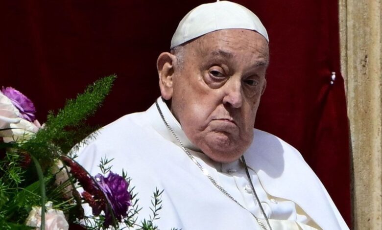 The image displays a picture of Pope Francis
