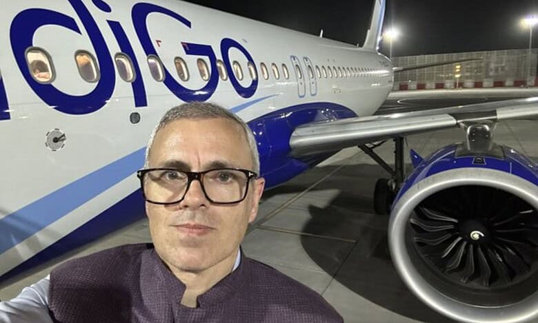 The image shows a selfie picutre of J&K CM Omar Abdullah in front of an IndiGo airline at the Delhi Airport