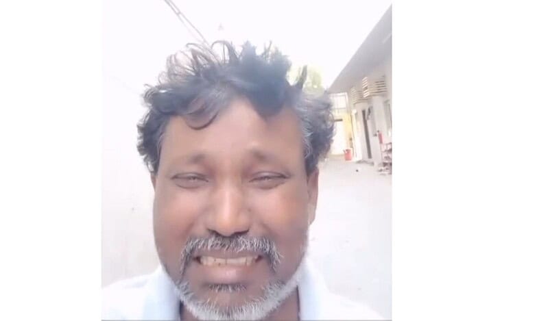 The image displays a picture of a stranded Telangana Gulf worker. April 26, 2025