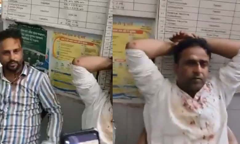 The image shows two brothers soaked in blood after they were attacked by an angry mob in Bihar