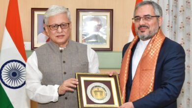 Telangana governor meets Iran consul General hands over memento with an Indian flag in the background