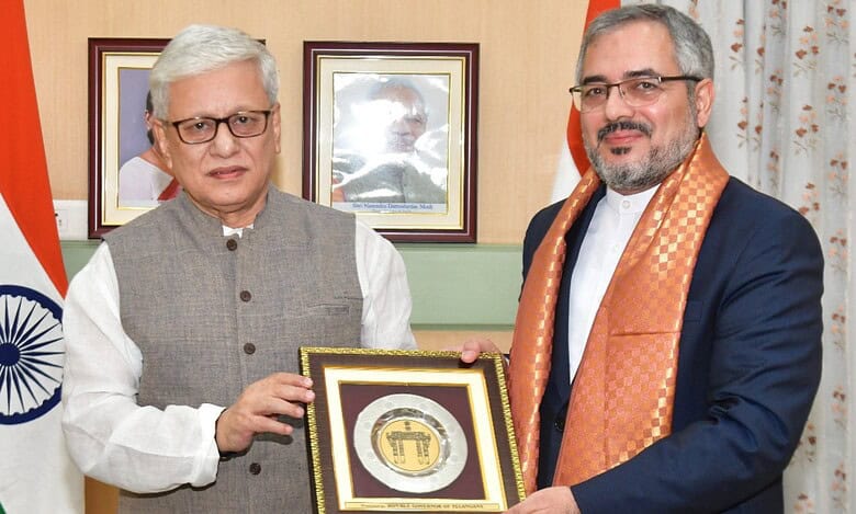 Telangana governor meets Iran consul General hands over memento with an Indian flag in the background