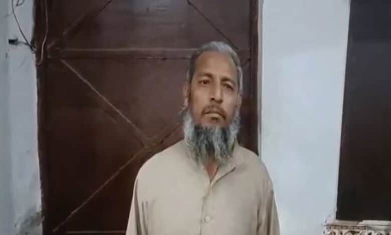 A man records statement with the police after being arrested for hoisting Palestinian flag at home in Meerut in UP